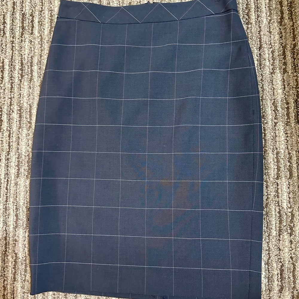Classic soft plaid straight skirt. Fully lined with easy back zip and back slit.